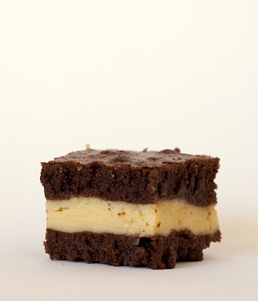 Rich brownies surround a sweet layer of cream cheese flavored with Irish Cream in these Irish Cream Brownies! - Bake or Break