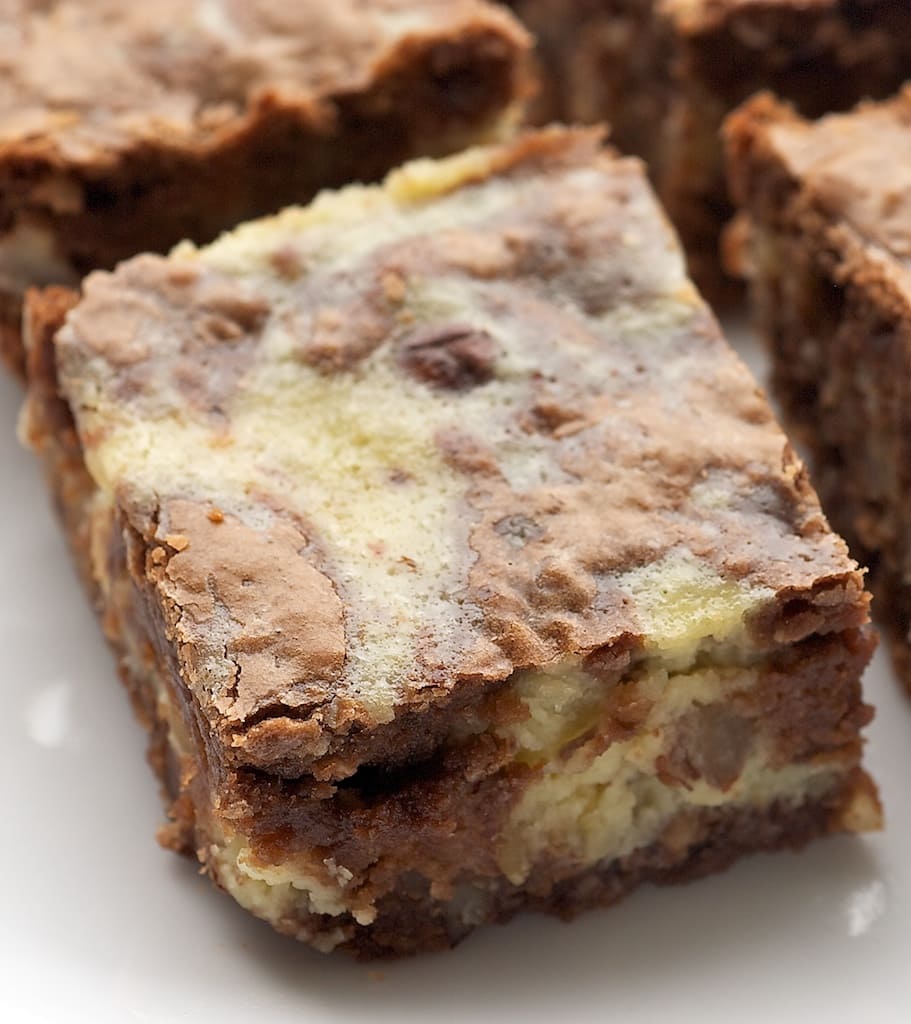 Hazelnut Cream Cheese Brownies are rich brownies packed with hazelnuts and swirled with a sweet cream cheese filling. - Bake or Break