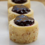 Vanilla Bean Mini Cheesecakes with Blueberry Sauce