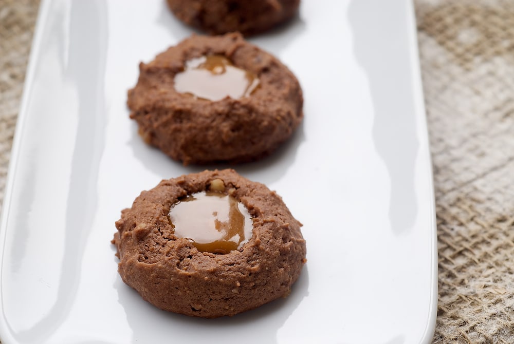 Turtle Cheesecake Thumbprint Cookies take that favorite classic dessert and turn it into sweet, rich cookies! - Bake or Break