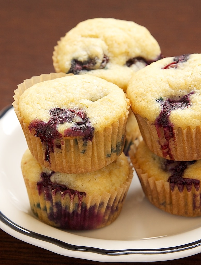 Blueberry Sour Cream Mini Muffins have plenty of fresh blueberries along with a hint of lemon. They're just the thing for a special breakfast treat! - Bake or Break