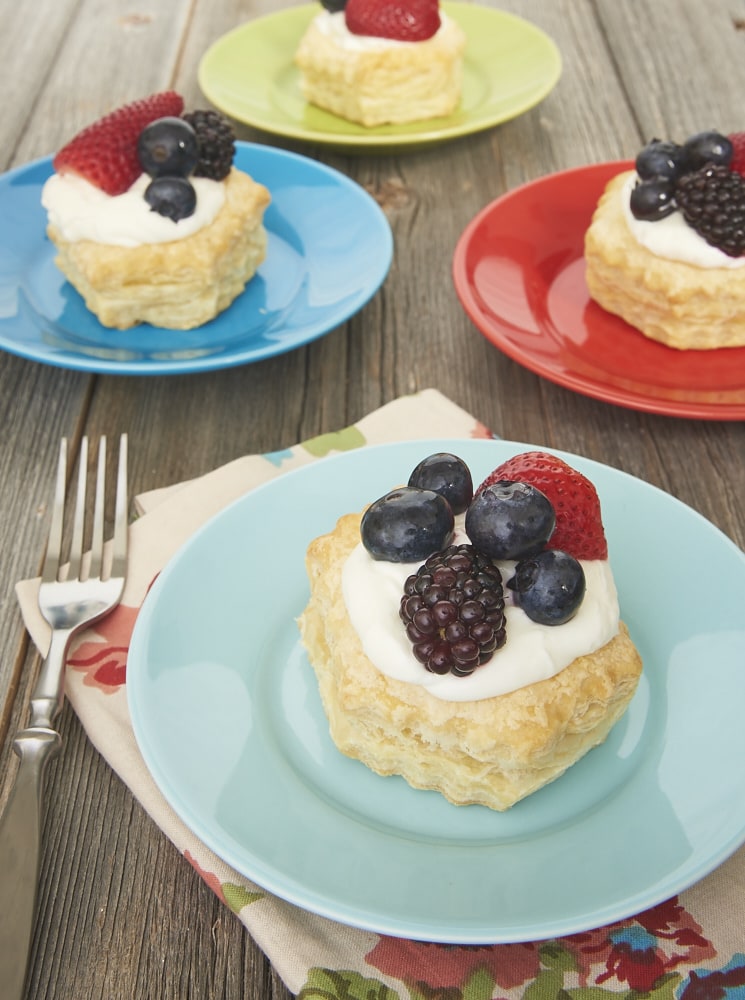 Puff pastry, a creamy filling, and fresh berries come together quickly and simply to make these luscious Berries and Cream Tartlets. - Bake or Break