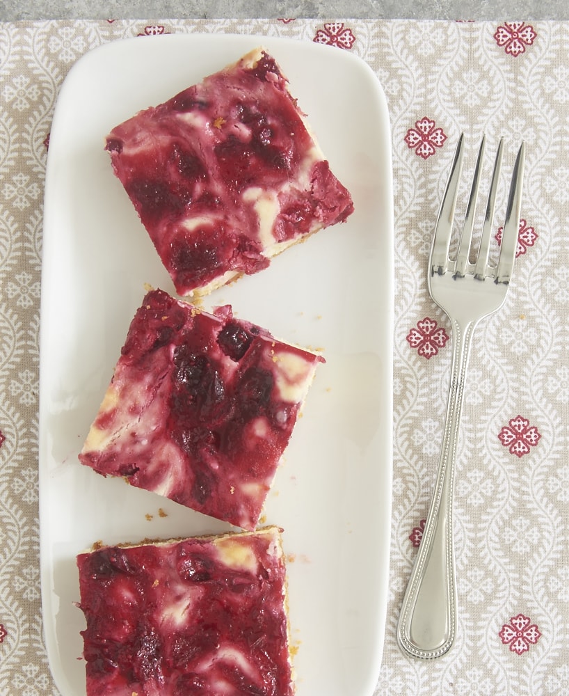 Cranberries and white chocolate are perfect complements in these irresistible Cranberry White Chocolate Cheesecake Bars! - Bake or Break