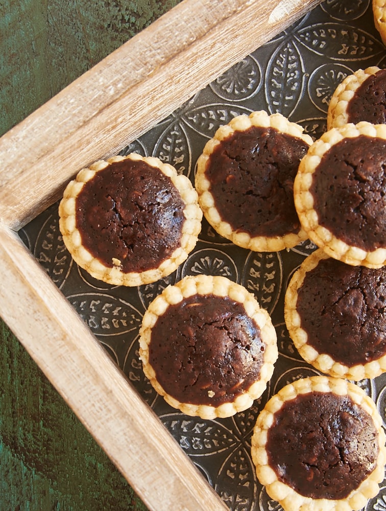 Rich, fudgy Chocolate Peanut Butter Tassies are a tasty two-bite treat. Perfect for entertaining! - Bake or Break