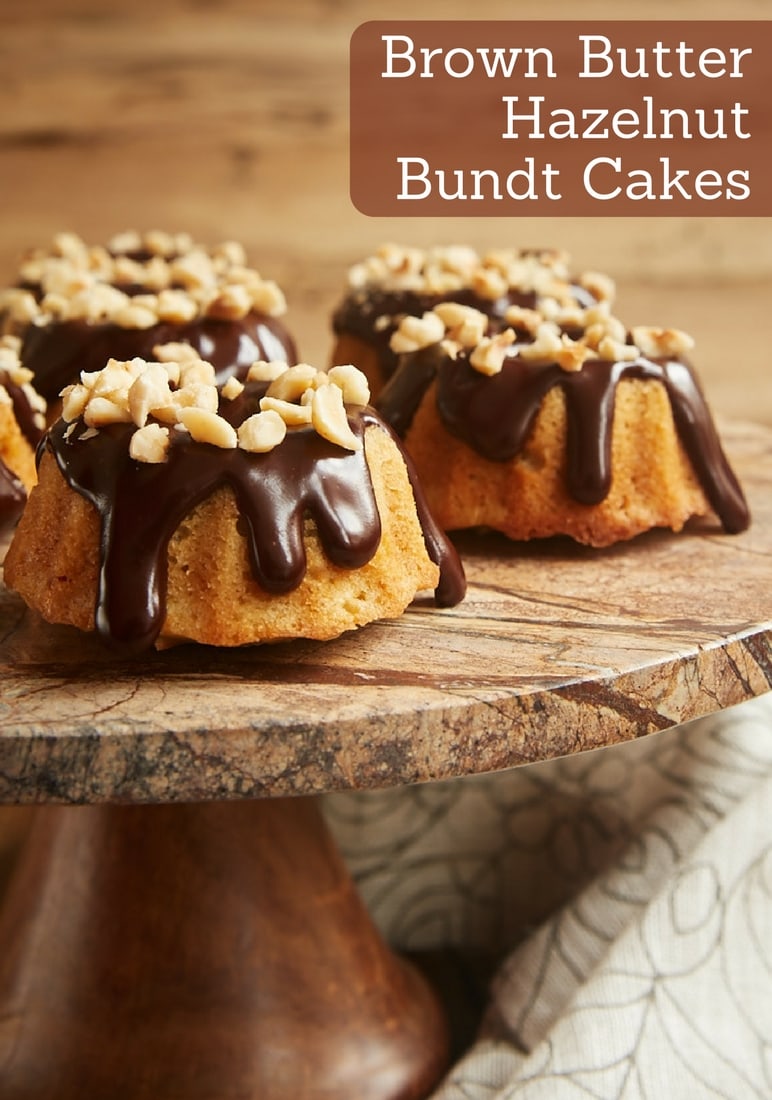 Brown Butter Hazelnut Bundt Cakes are little treats with big flavor. Toasted hazelnuts, browned butter, and dark chocolate ganache combine for an irresistibly delicious dessert! - Bake or Break