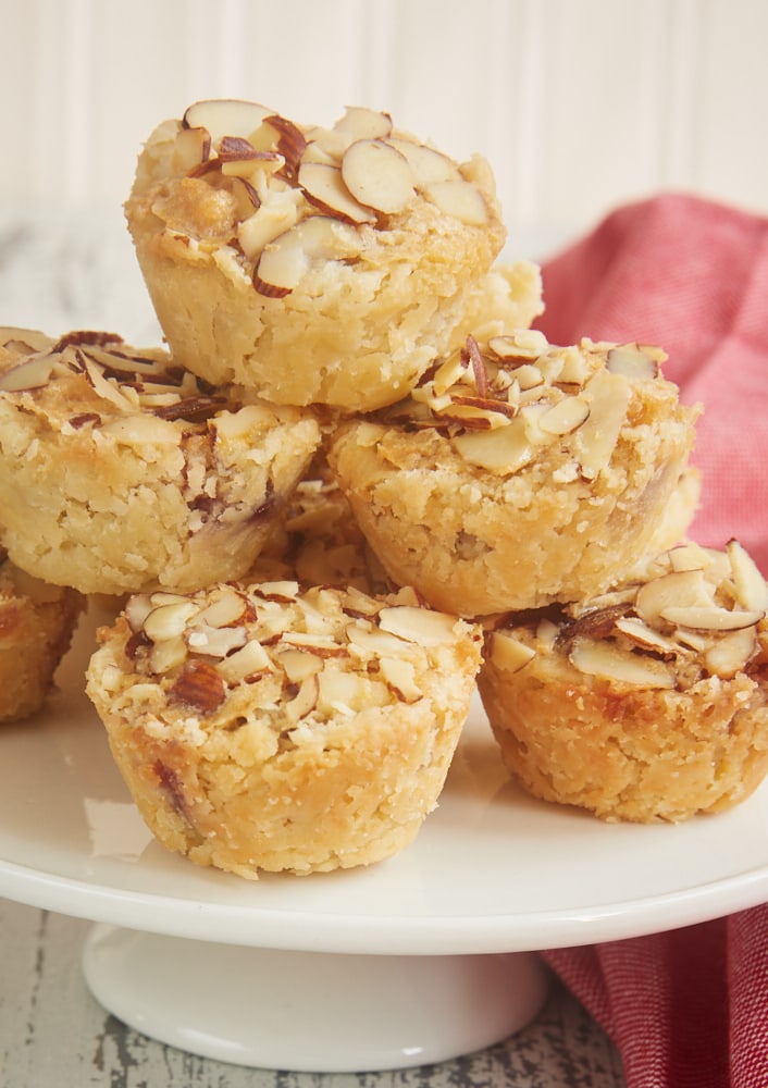 Raspberry Almond Tarts are simple bite-size tarts made with raspberry preserves and almond paste. Such a great flavor combination! - Bake or Break